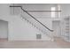 Bright staircase with white railings and wooden banister at 595 Weathersfield # A, Pittsboro, NC 27312