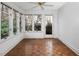 Charming sunroom with hardwood floors, natural light, and backyard access at 595 Weathersfield # A, Pittsboro, NC 27312