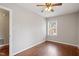 Bright bedroom features hardwood floors, neutral walls, and a ceiling fan at 617 Bernice St, Durham, NC 27703