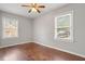 Bedroom with hardwood floors and windows looking out onto the surrounding property at 617 Bernice St, Durham, NC 27703