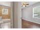Bedroom view features hardwood floors and natural light with access to the bathroom at 617 Bernice St, Durham, NC 27703