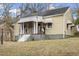 Home exterior view features a covered front porch and a walkway at 617 Bernice St, Durham, NC 27703