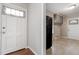 Eat-in kitchen area with a side door entrance and views into the rest of the home at 617 Bernice St, Durham, NC 27703