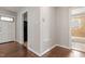 View of the living room area with hardwood flooring and entry into other parts of the house at 617 Bernice St, Durham, NC 27703