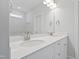 Well-lit bathroom featuring a double vanity with white countertops and modern fixtures at 625 Spellbrook Rd, Zebulon, NC 27597