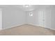 Neutral bedroom with carpeting and natural light from the window, featuring a closet for storage at 625 Spellbrook Rd, Zebulon, NC 27597