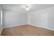 Spacious bedroom with wood floors, a ceiling fan, and plenty of natural light at 625 Spellbrook Rd, Zebulon, NC 27597
