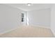 Neutral carpeted bedroom with a window offering views at 625 Spellbrook Rd, Zebulon, NC 27597