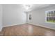 Bright bedroom features wood floors and windows that let in plenty of natural light at 625 Spellbrook Rd, Zebulon, NC 27597