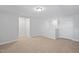 Bonus room with neutral carpet, multiple doorways, and ample space for versatile use at 625 Spellbrook Rd, Zebulon, NC 27597