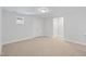Bonus room with neutral carpet, multiple doorways, and ample space for versatile use at 625 Spellbrook Rd, Zebulon, NC 27597