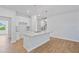 Bright kitchen with island, granite countertops, stainless faucet, and pendant lighting at 625 Spellbrook Rd, Zebulon, NC 27597