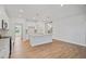 Open concept kitchen with an island, stainless steel faucet, and pendant lighting at 625 Spellbrook Rd, Zebulon, NC 27597