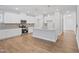 Bright kitchen with an island, stainless steel appliances, and granite countertops at 625 Spellbrook Rd, Zebulon, NC 27597