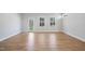 Bright living room features wood floors, natural light, and backyard access at 625 Spellbrook Rd, Zebulon, NC 27597