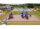 View of the playground near the pool, with a blue slide and climbing structures at 625 Spellbrook Rd, Zebulon, NC 27597
