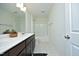 Clean bathroom featuring a double sink vanity with quartz countertops and a shower-tub combination at 704 Vance St, Mebane, NC 27302
