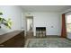 Stylish bedroom showcasing a dresser with decor, natural light from the window, and a view into an adjacent room at 704 Vance St, Mebane, NC 27302