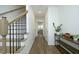Hallway with hardwood floors, a staircase, and modern decor at 704 Vance St, Mebane, NC 27302