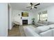 Bright living room with fireplace, plush seating, and natural light at 704 Vance St, Mebane, NC 27302