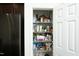 Walk-in pantry with wire shelving and many different kinds of food inside the package at 704 Vance St, Mebane, NC 27302