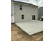 Exterior view of the home with a concrete patio and a newly seeded yard at 745 Little Patch St, Zebulon, NC 27597