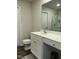 Bright bathroom features a white vanity with plenty of counter space and a framed mirror at 745 Little Patch St, Zebulon, NC 27597