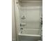 Clean bathroom features a shower-tub combo with a white surround and shelving at 745 Little Patch St, Zebulon, NC 27597