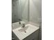 Bathroom vanity with a white countertop, sink, faucet and a framed mirror above at 745 Little Patch St, Zebulon, NC 27597