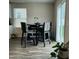 Dining room area features sliding glass door with a view of the green backyard at 745 Little Patch St, Zebulon, NC 27597