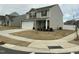 Charming two-story home features a two-car garage, stone accents, and a well-manicured front yard at 745 Little Patch St, Zebulon, NC 27597