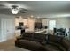 Open-concept kitchen and living area featuring modern appliances, central island and comfortable sectional sofa at 745 Little Patch St, Zebulon, NC 27597
