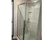 Shower features bright tile and a frameless glass shower door at 745 Little Patch St, Zebulon, NC 27597