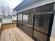 Relaxing back porch featuring an outdoor view of neighboring houses and lush trees at 945 Lynch Rd, Selma, NC 27576