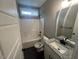 Bathroom featuring a shower-tub combo and granite vanity at 945 Lynch Rd, Selma, NC 27576