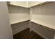 Bright walk-in closet with shelving and hanging space at 945 Lynch Rd, Selma, NC 27576