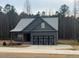 Charming single-story home featuring a two-car garage and a neatly kept front lawn at 945 Lynch Rd, Selma, NC 27576