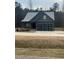 Charming single-story home featuring a two-car garage and a neatly kept front lawn at 945 Lynch Rd, Selma, NC 27576
