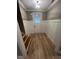 Inviting foyer features wood flooring, wainscoting, and a front door at 945 Lynch Rd, Selma, NC 27576