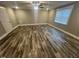 Living room featuring hardwood floors, a window, a ceiling fan, and neutral paint at 945 Lynch Rd, Selma, NC 27576