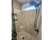 Close up of shower featuring marble tile, seat, and overhead shower head at 945 Lynch Rd, Selma, NC 27576