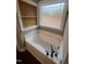 Close up of tub, wood trim, and window at 945 Lynch Rd, Selma, NC 27576