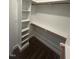 Walk-in closet featuring wood shelving and bar for storage at 945 Lynch Rd, Selma, NC 27576