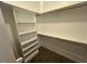 Walk-in closet featuring wood shelving and bar for storage at 945 Lynch Rd, Selma, NC 27576