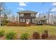 Expansive backyard with a lush green lawn, deck, and tasteful landscaping at 95 Blueberry Rdg, Pittsboro, NC 27312