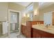 Bathroom with a double sink vanity, modern fixtures, decorative mirrors and recessed lighting at 95 Blueberry Rdg, Pittsboro, NC 27312