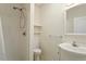Clean bathroom featuring a walk-in shower, modern sink, and simple decor at 95 Blueberry Rdg, Pittsboro, NC 27312