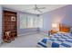 Bright bedroom with large windows, ceiling fan and bookshelf at 95 Blueberry Rdg, Pittsboro, NC 27312