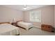 Bright and spacious secondary bedroom with natural light and neutral tones at 95 Blueberry Rdg, Pittsboro, NC 27312