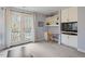 Cozy bedroom features built-in desk and cabinets and access to balcony at 95 Blueberry Rdg, Pittsboro, NC 27312